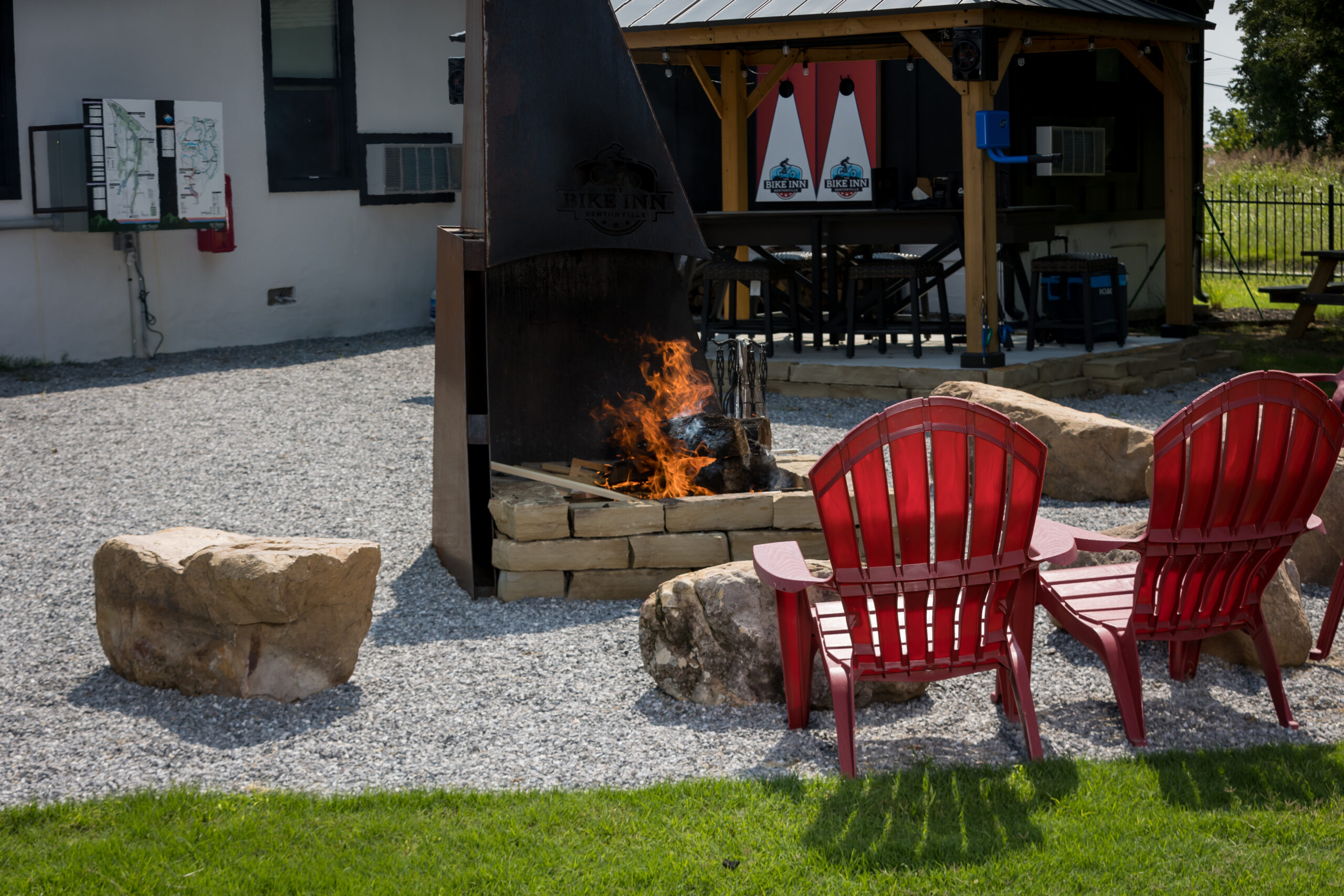 Fire pit and covered pavilion at The Bike Inn, a Bentonville wedding venue with lodging